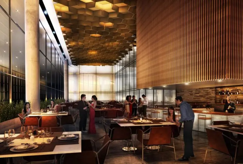 Moderno interior de restaurante elegante con ambiente sofisticado, iluminación cálida y mobiliario de alta calidad, ideal para eventos y cenas exclusivas en la ciudad.