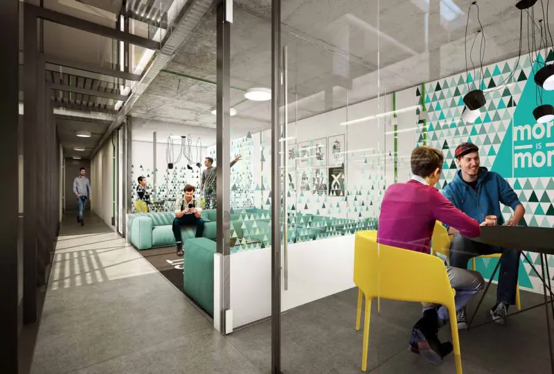 Oficina moderna con zonas de coworking y espacio para reuniones, ambiente profesional y acogedor, ideal para empresas y emprendedores que buscan un espacio flexible y funcional.