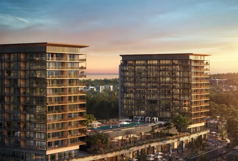 Modernos edificios residenciales con amplias terrazas y vistas al mar en un entorno urbano, perfectos para inversión inmobiliaria y vivienda en la mejor ubicación.